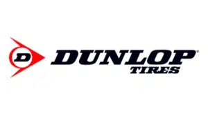 Dunlop Tires logo featuring a signature red arrow and bold text, representing a leading brand in high-performance tire manufacturing.