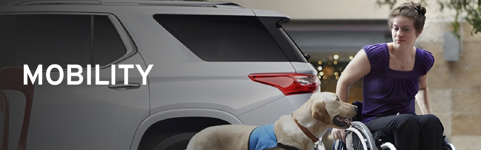 Woman in a wheelchair with a service dog next to an SUV, emphasizing mobility.
