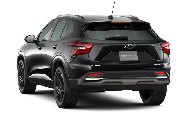 Sleek black modern SUV parked on a street, showcasing stylish wheels and aerodynamic design.